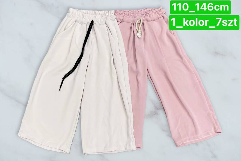 Spodnie dziewczęcy. Roz 110-146. 1 kolor Paczka 7 szt . 1