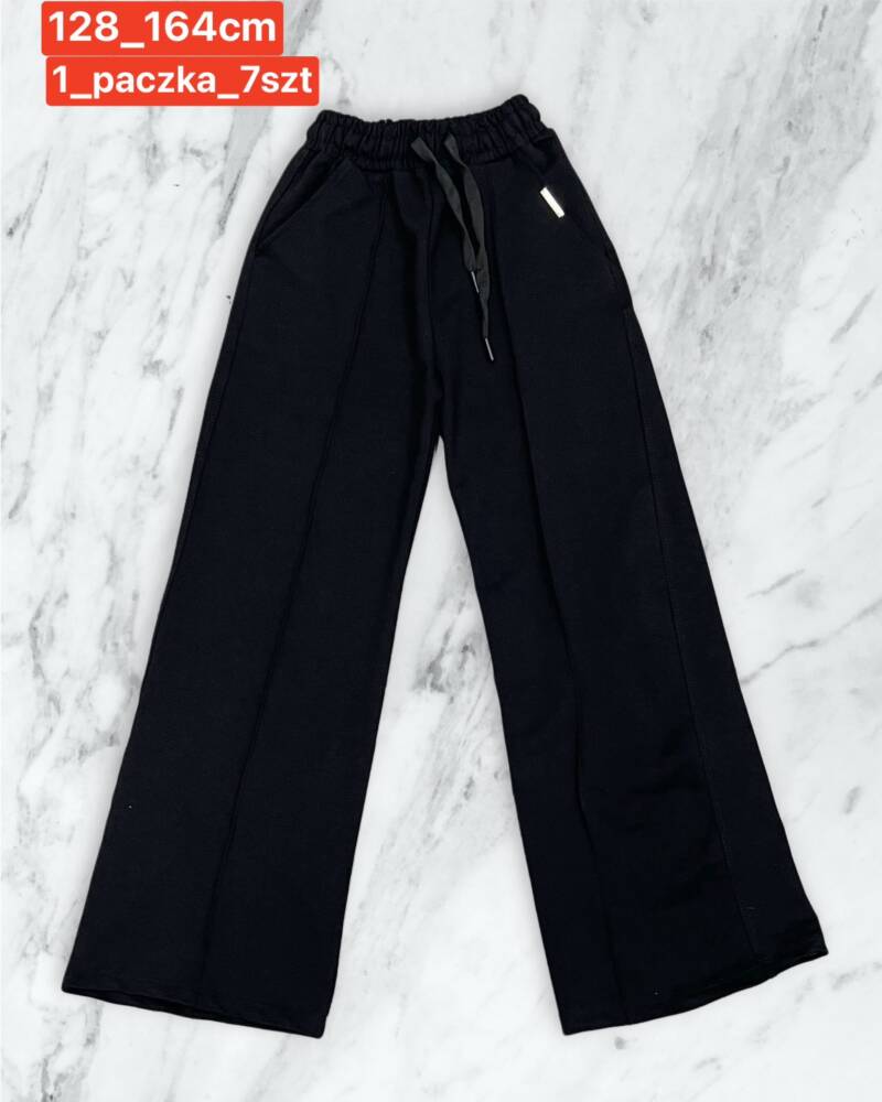 Spodnie dziewczęcy. Roz 128-164. 1 kolor Paczka 7 szt .